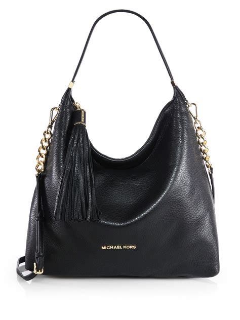 michael kors leather purse tassel|Michael Kors purse with pockets.